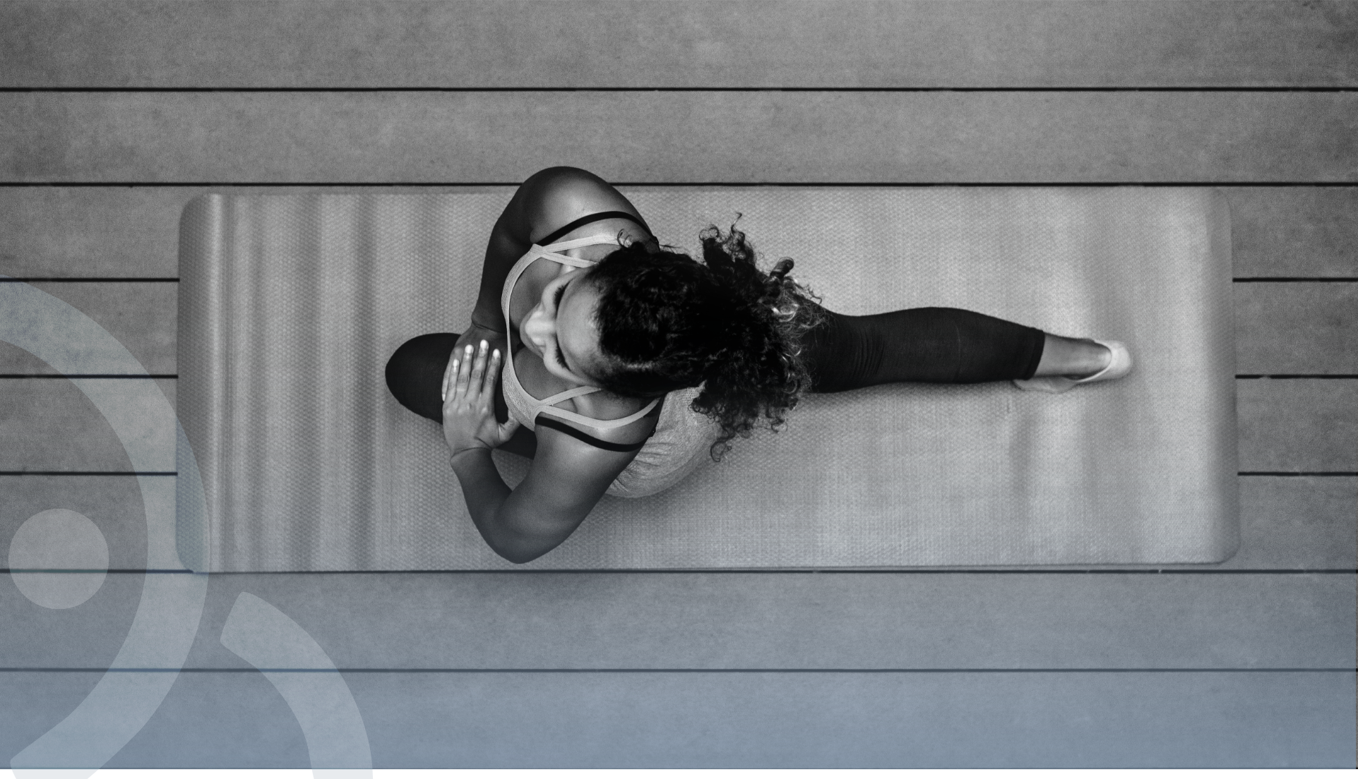 Pilates practitioner stretching on a mat