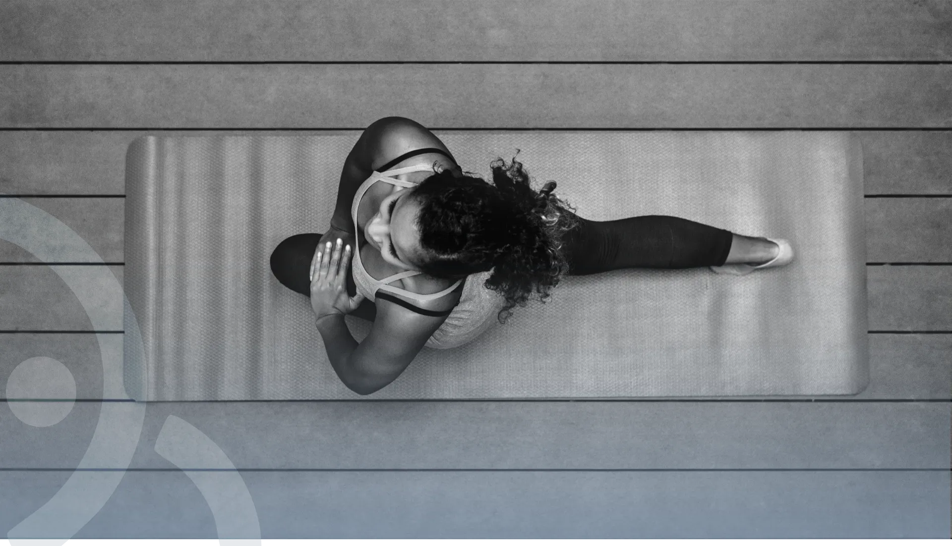 Pilates practitioner stretching on a mat